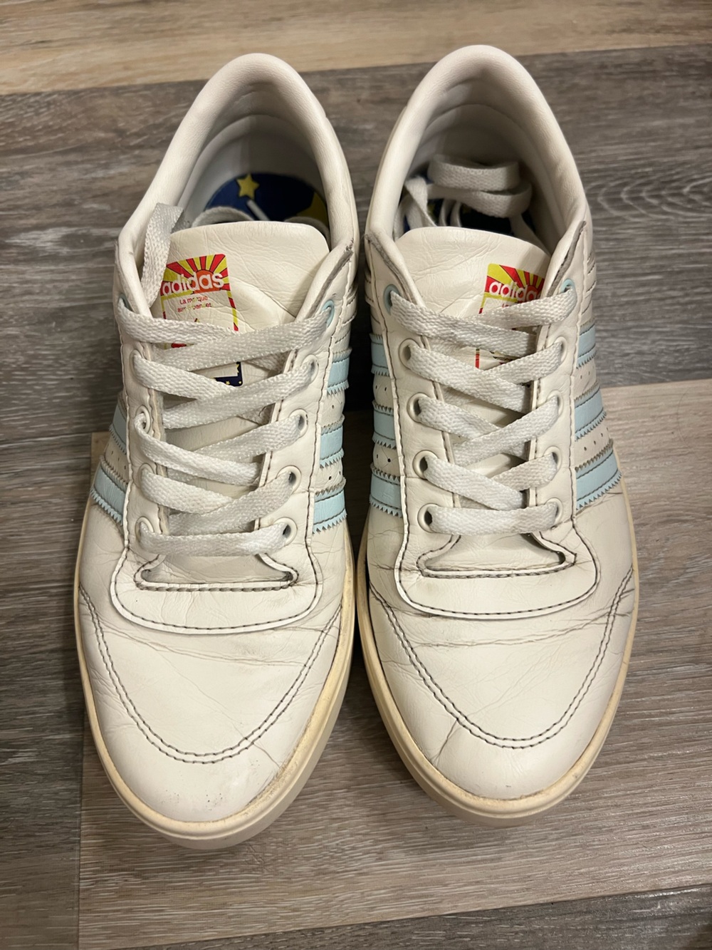 adidas women’s White Leather Sneakers with Light Blue Stripes